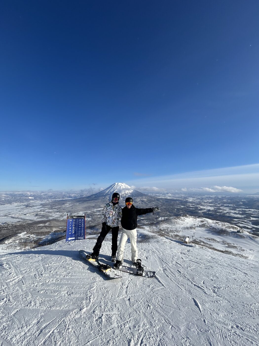 Anna and her partner snowboarding in Niseko, Japan